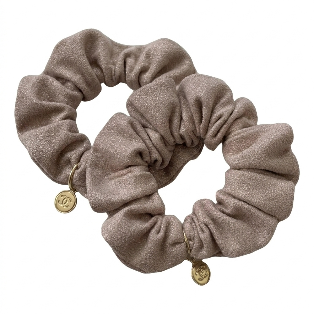 Chanel pink velvet hair elastic with a gold-tone logo charm